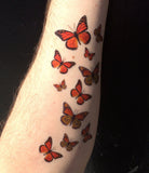 monarch butterfly arm tattoo